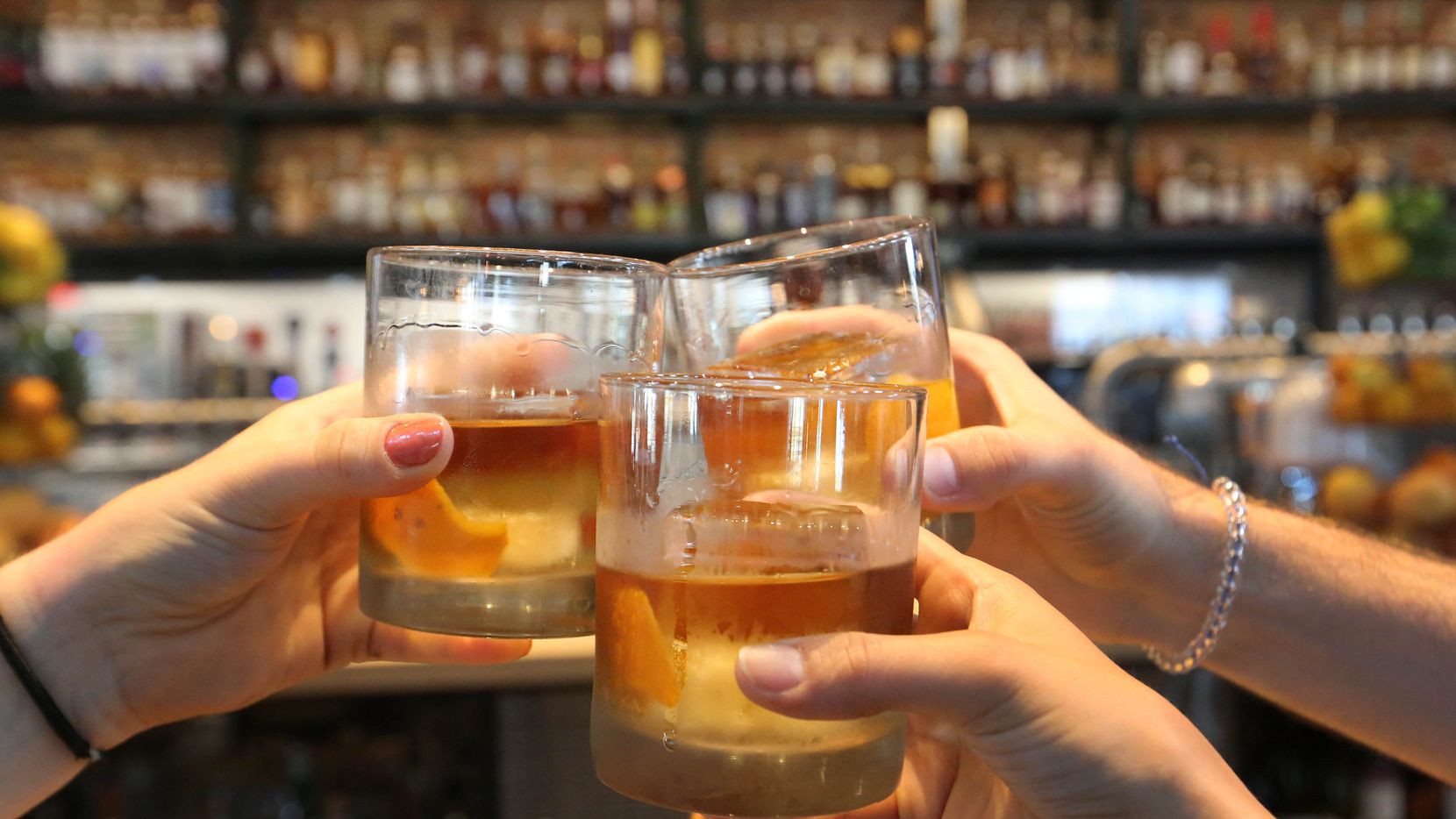 Bars in Texas are technically closed, according to a mandate by Gov. Greg Abbott. But bars are getting special food and beverage certificates from the Texas Alcoholic Beverage Commission, and more are opening every week. Should you go to one? (Louis DeLuca/Staff Photographer)