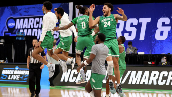 The North Texas Mean Green celebrate their victory over the Purdue Boilermakers
