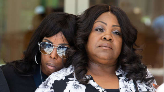 Kamona Nelson leans on LaSandra Scott