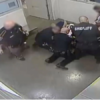 jailers restraining Marvin Scott III before his death