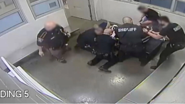 jailers restraining Marvin Scott III before his death