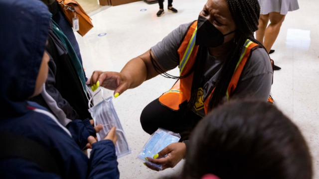 Principal Shanieka Christmas-McDonald hands out masks