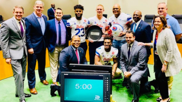 SMU football players showed off the Iron Skillet at Dallas City Hall after winning it in 2019.