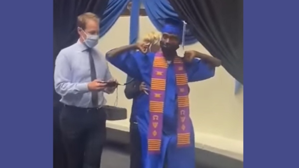 Corey Borner walks across the stage