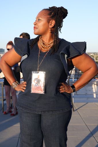 Candidate Amye Thompson Hollins strikes a pose at the Blue Party kickoff event.