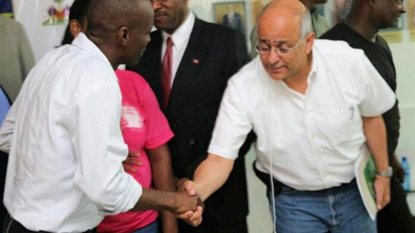 Jovenel Moise Andy Apaid shaking hands