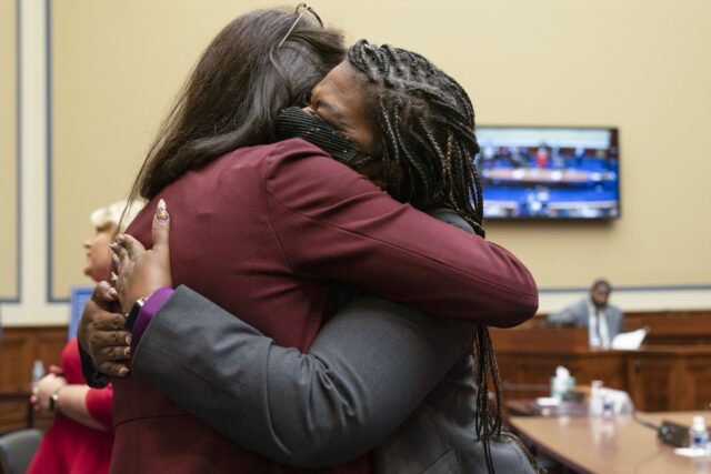 Rep. Cori Bush, D-Mo., right, is hugged by Rep. Rashida Tlaib