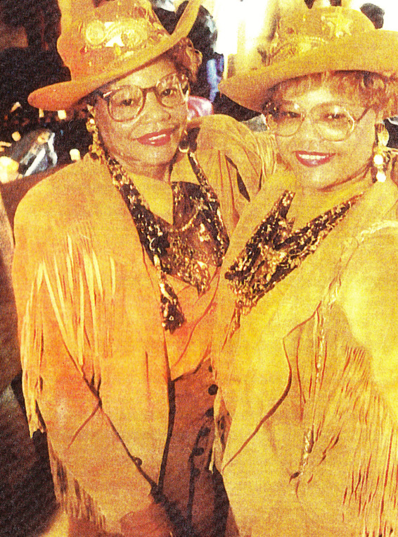 Twins in gold, fringe attire
