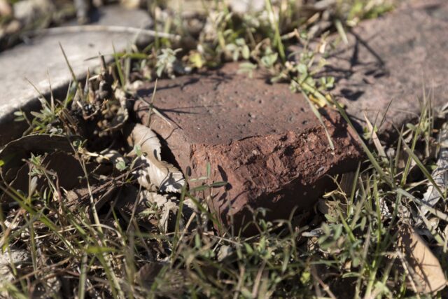 Bricks from the original building lay