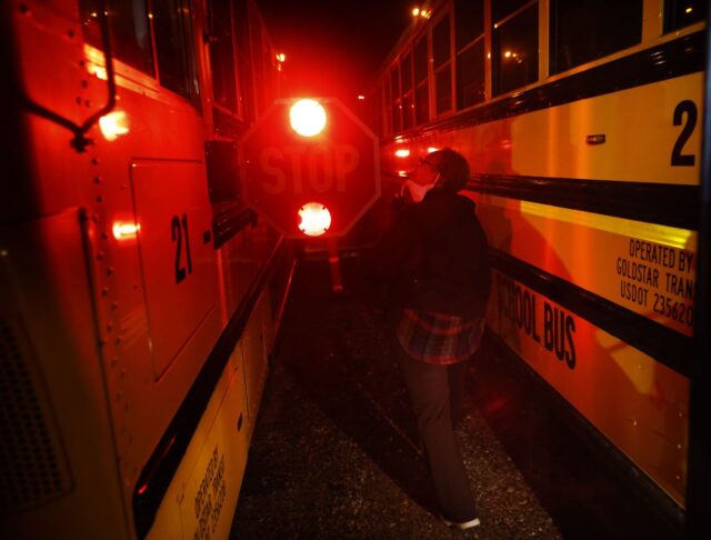 Bus driver Schrildea Glover performs an inspection