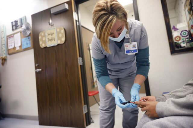 Stephanie Taylor makes a glucose check