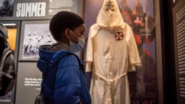 A boy inside the Greenwood Rising museum