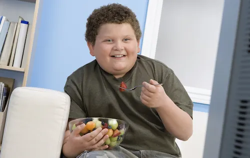 Boy eating fruit