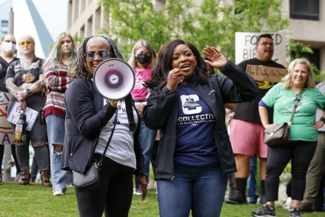 Texas House Rep. Jasmine Crockett (right) speaks alongside Michelle Anderson