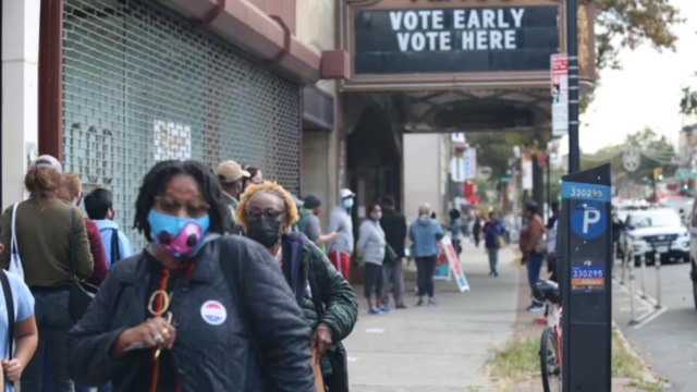 Voters walk out of the Kings Theatre