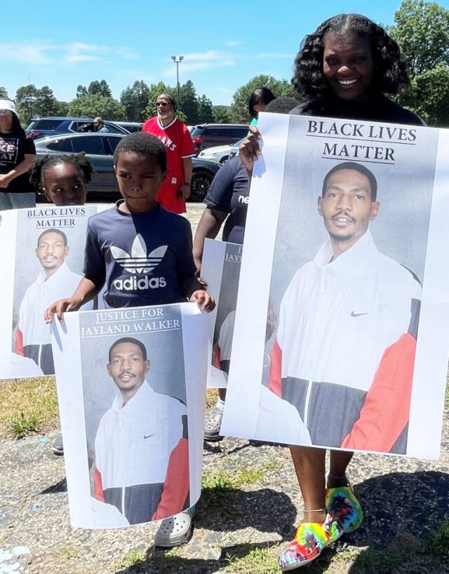 Memorial posters were carried at Peace Rally.