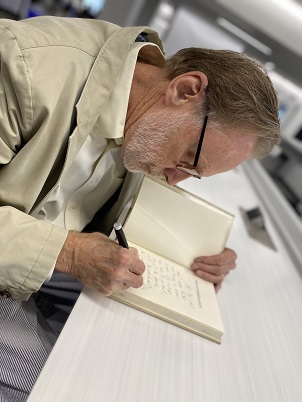 The Accommodation author Jim Schutze signs book during launch of Big D Reads