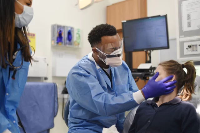 Dr. Dan Burch works on a patient