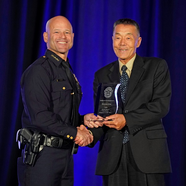 Dallas Police Chief Eddie Garcia and Non-Sworn Employee of the Year Eunsup Kim