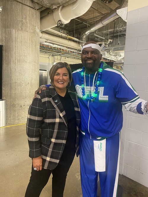 Wings Coach Latricia Trammell and Big Rob Maiden, Mavs Maniaacs Captain