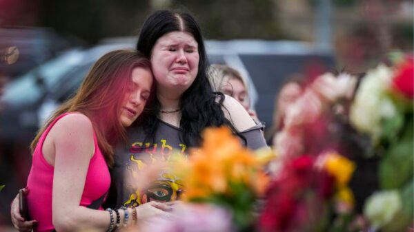 Alexa Keith (center) hugs Brooklyn Deese
