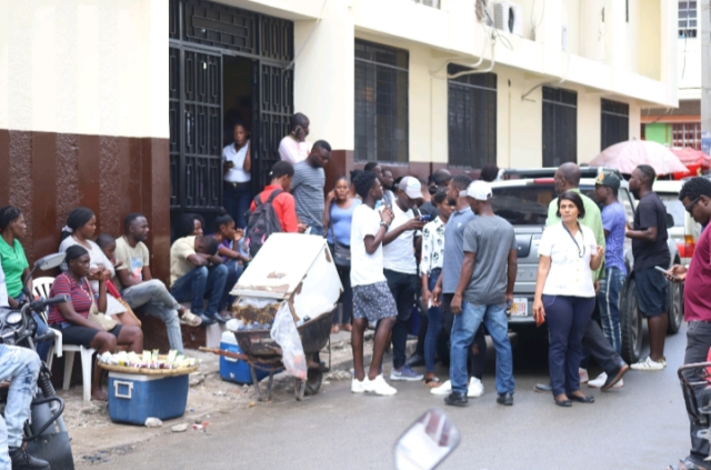 Haitians waiting in front of the Immigration Office