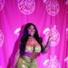 Erica Banks smiles for the cameras at the Pink Plate Tasting