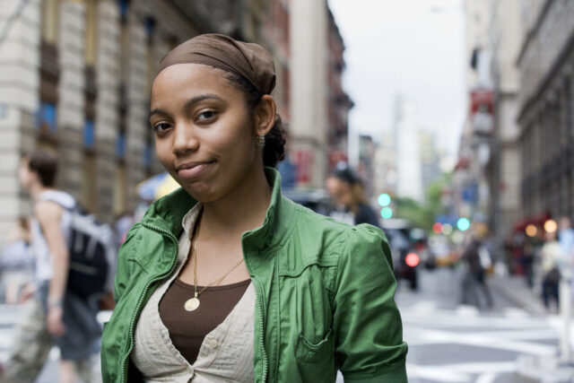 Portrait of young Hispanic woman in downtown city