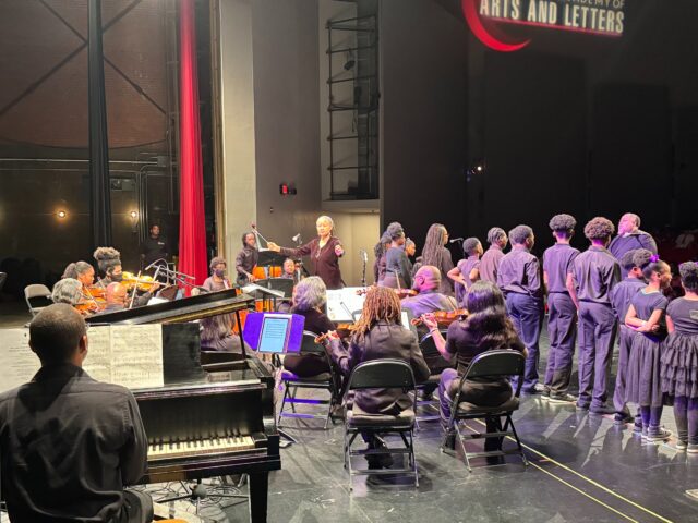 Dr. Anne Lundy directs orchestra while South Dallas Children_s Choir sings at Scott Joplin Chamber Orchestra concert in Dallas Feb. 3, 2024