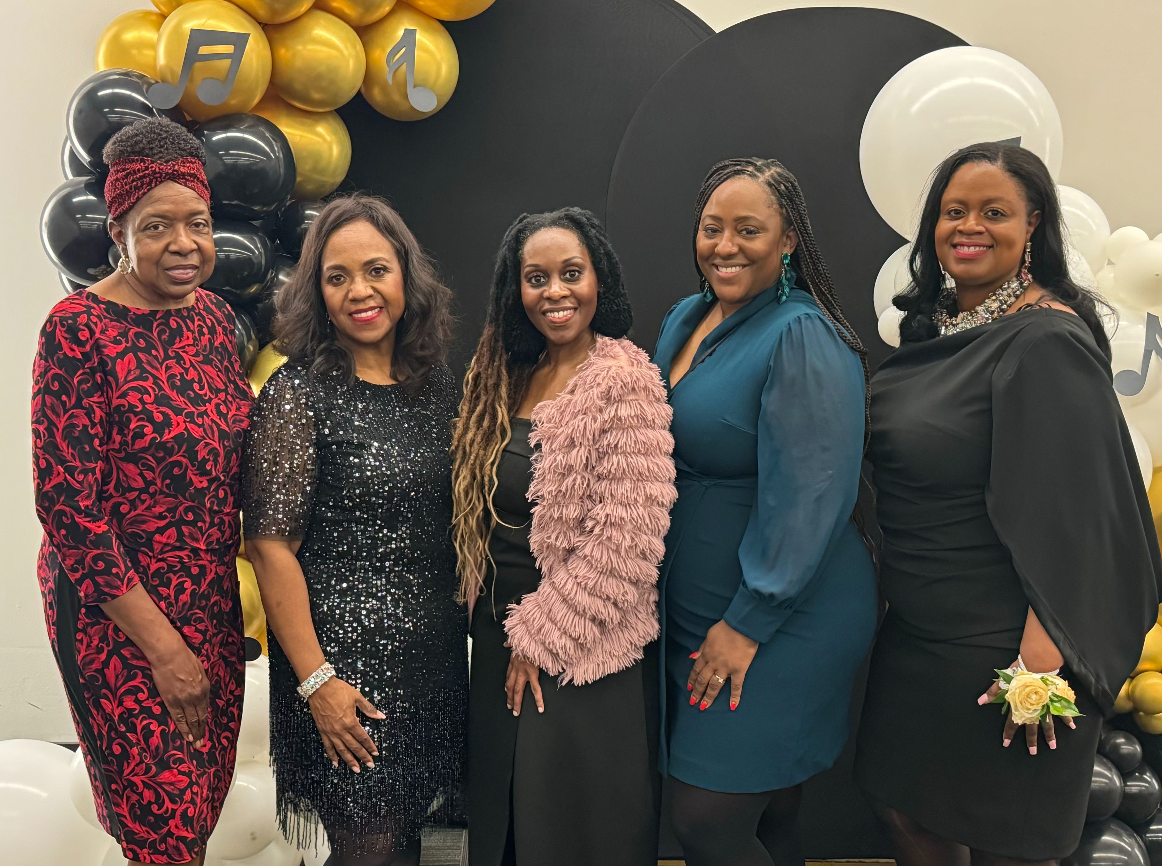 Event Chair Vivian Johnson poses with planning committee at VIP dinner following Scott Joplin Chamber Orchestra concert in Dallas Feb. 3, 2024
