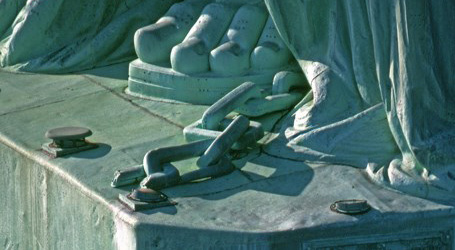 Chains on statue’s ankle.