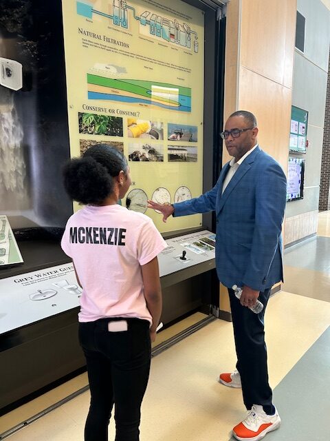 Congressman Marc Veasey talking with JMS student McKenzie Pleasant about the school's natural filtration system.
