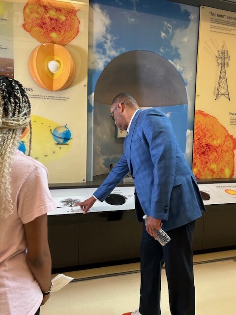 Congressman Marc Veasey testing the wind turbine controls at Johnson Middle School in Irving.