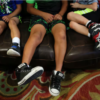 boys sit on the couch at a licensed,