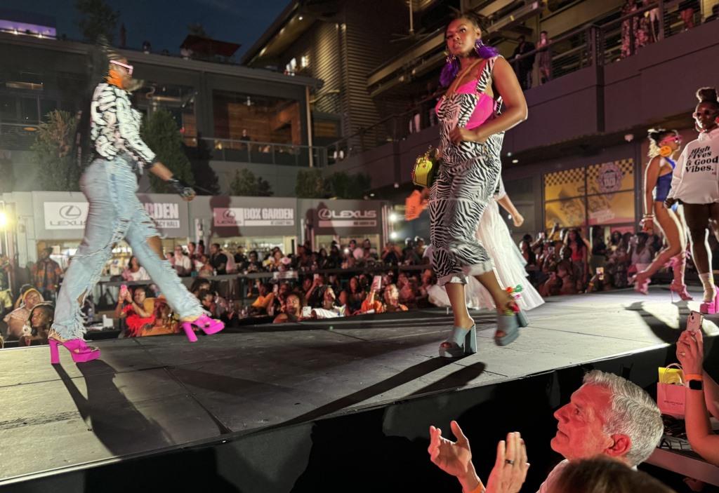 Plano Mayor John Muns applauds fashions he sees on runway during Juneteenth Fashion Show in Plano, Texas June 15, 2024