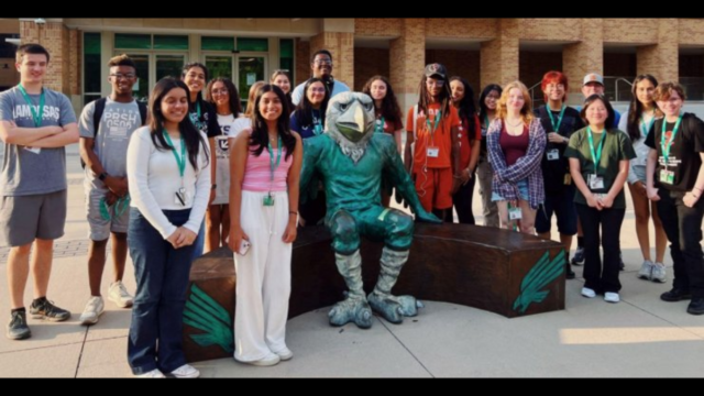 Journalism students with UNT mascot 