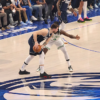 Luka Doncic keeps hte ball away from Celtics Jrue Holiday