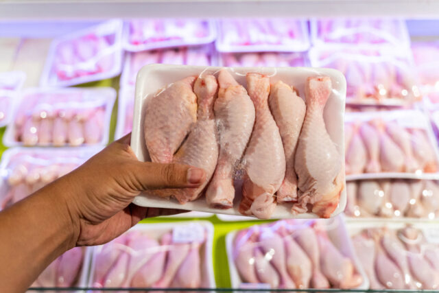 Point of View Hand Holding Raw Meat  in a grocery store