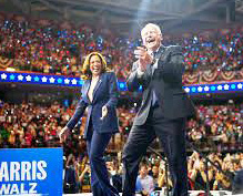 Kamala Harris and Tim Walz being joyous with audience.