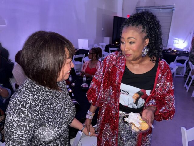 Dr. Cheryl Polote Williamson speaks with attendee during Ageless, Fearless, Unscripted podcast screening in Dallas Sept. 13, 2024