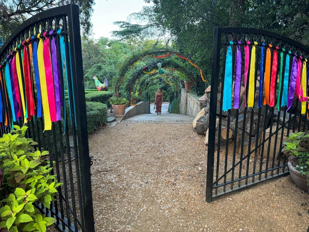 Attendee arriving at HCDFW Rosie Casals Lifetime Achievement Celebration at residence in Dallas