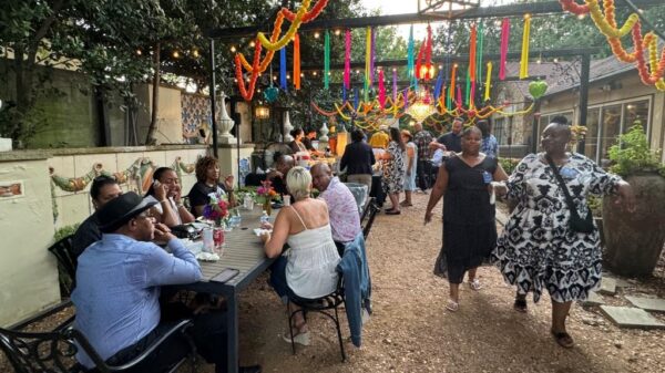 Attendees enjoying outdoors during HCDFW Rosie Casals Lifetime Achievement Celebration at residence in Dallas