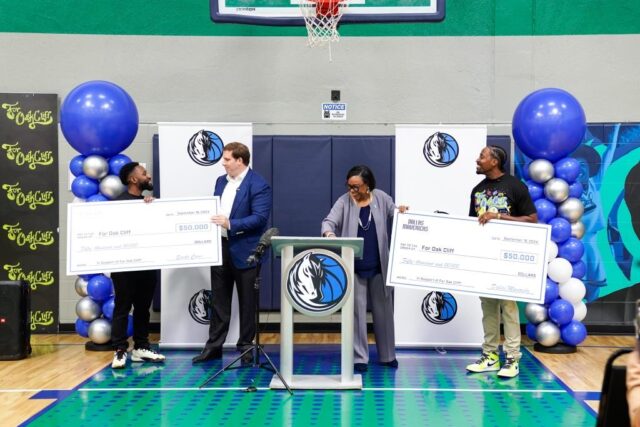 For Oak Cliff Acceps $100,000 check presentations from Dallas Mavericks