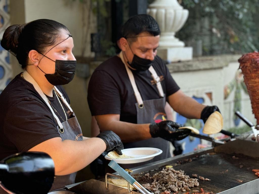 Tacos and quesadillas being prepared onsite during HCDFW Rosie Casals Lifetime Achievement Celebration at residence in Dallas