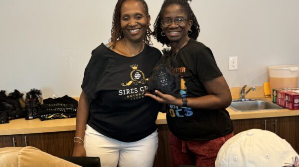 Sires Crown Founder_CEO LaShawn Johnson with door prize winner at launch event Oct. 26, 2024 in Plano, TX