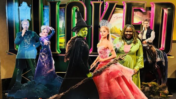 Eva D. Coleman at cutout display during Wicked movie screening at AMC Northpark on Nov. 17, 2024