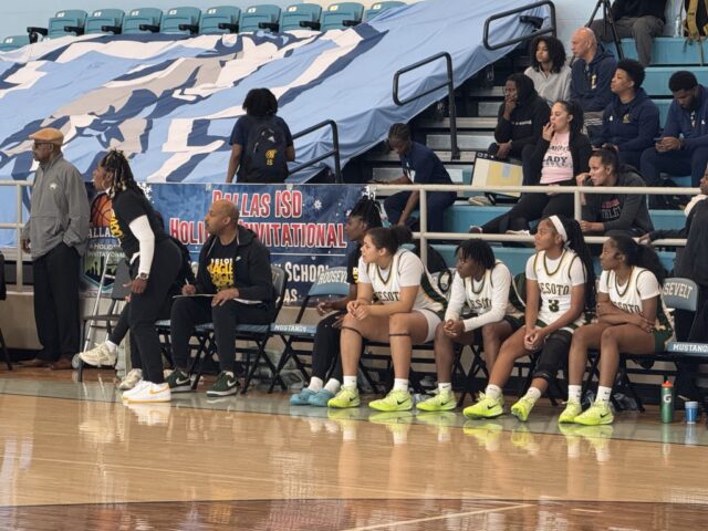 DISD Holiday Tournament - Deoto coach on their feet while players look on during game