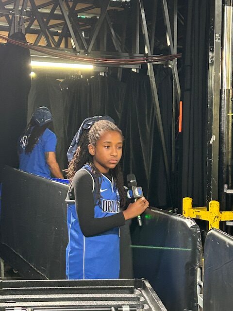 Mavs Kid Reporter Sarai Stokes-Mitchell waits for players to warm up in the tunnell