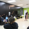 Natasha Gerald leads meeting to discuss naming of field.