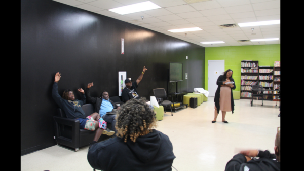 Natasha Gerald leads meeting to discuss naming of field.